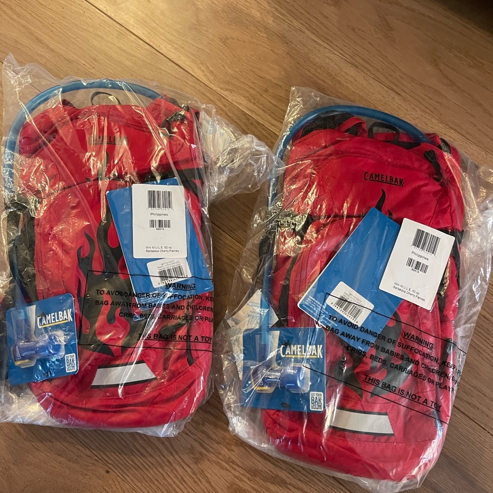 Selling 2 never opened camelbak kids hydration packs. Red flame.Price is for 1.